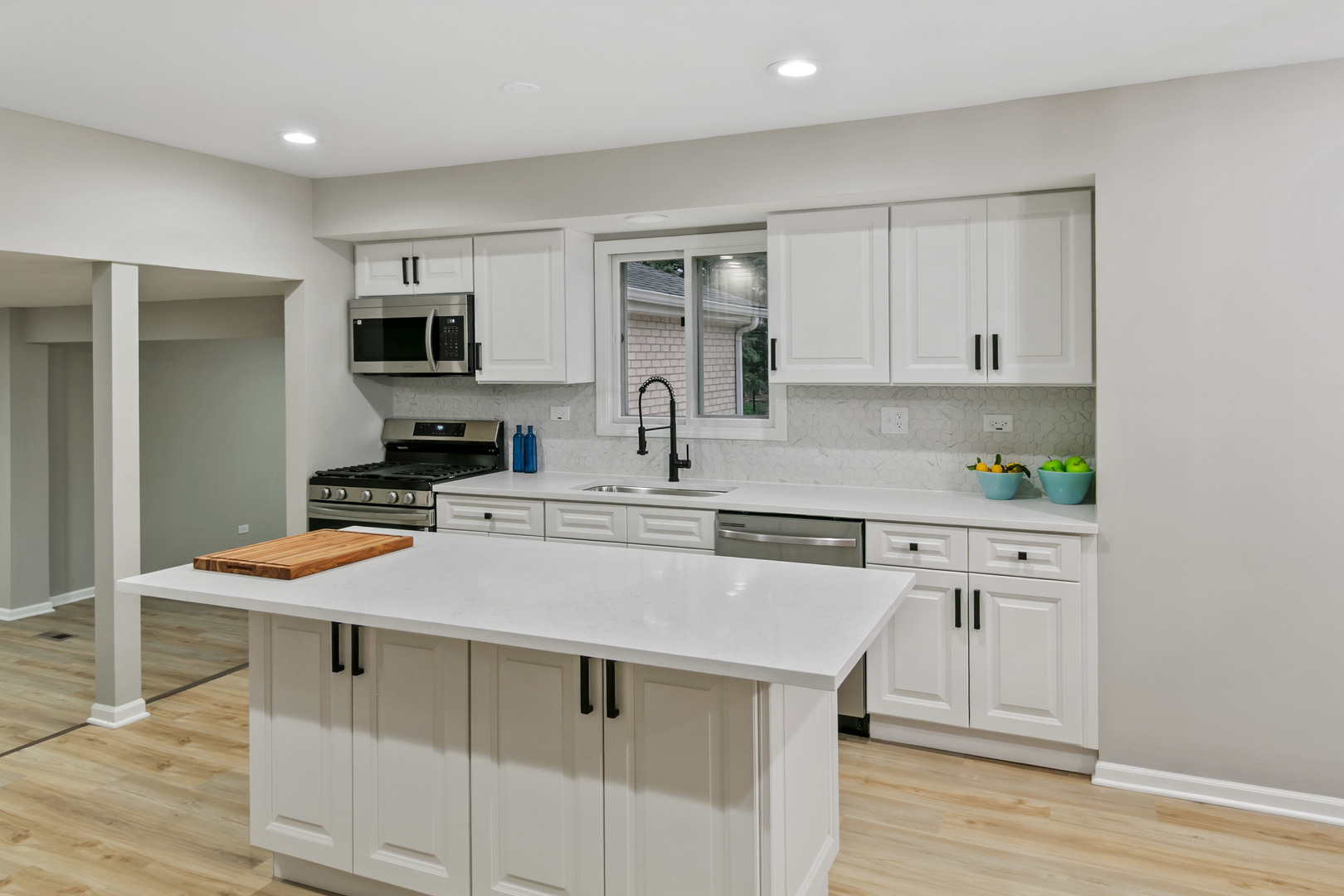 1554 Chickasaw Drive Naperville, IL 60563 - Photo 7 of 32 a kitchen with stainless steel appliances granite countertop a sink stove and refrigerator