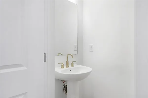 a bathroom with a sink and mirror