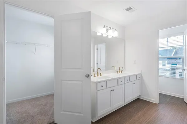 a view of bathroom with dual sinks