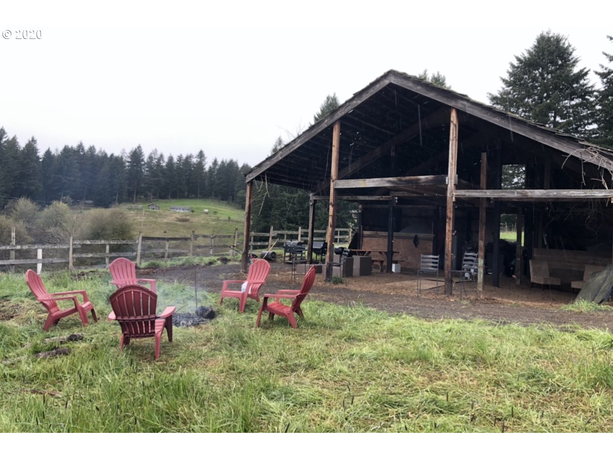 26400 Southwest Petes Mountain Road West Linn, OR 97068 - Photo 8 of 32 a backyard of a house with yard table and chairs