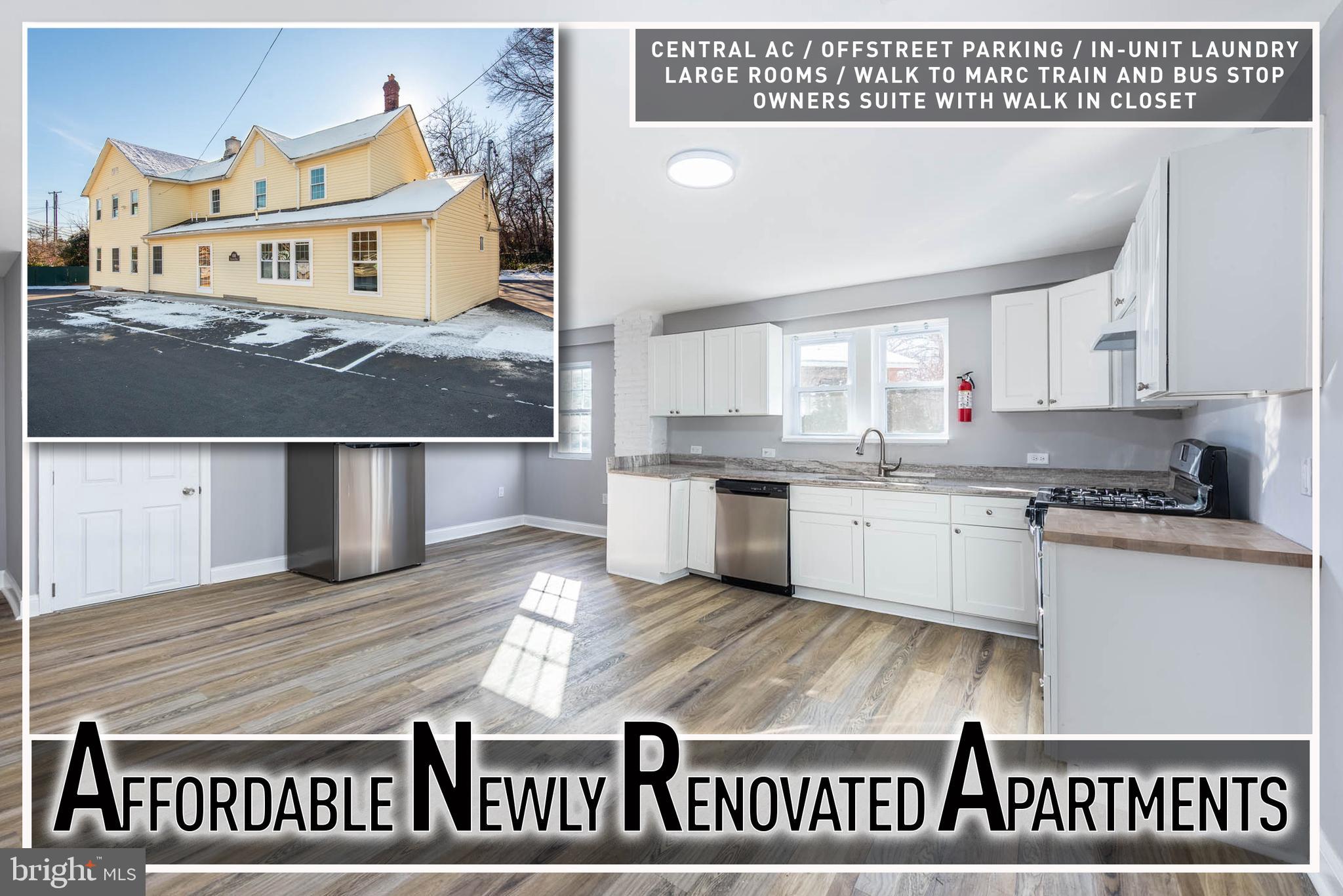 a kitchen with kitchen island granite countertop a sink window and cabinets