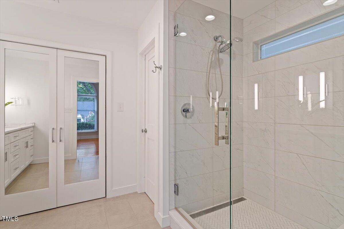 5821 Edgebury Road Raleigh, NC 27613 - Photo 20 of 37 a bathroom with a shower