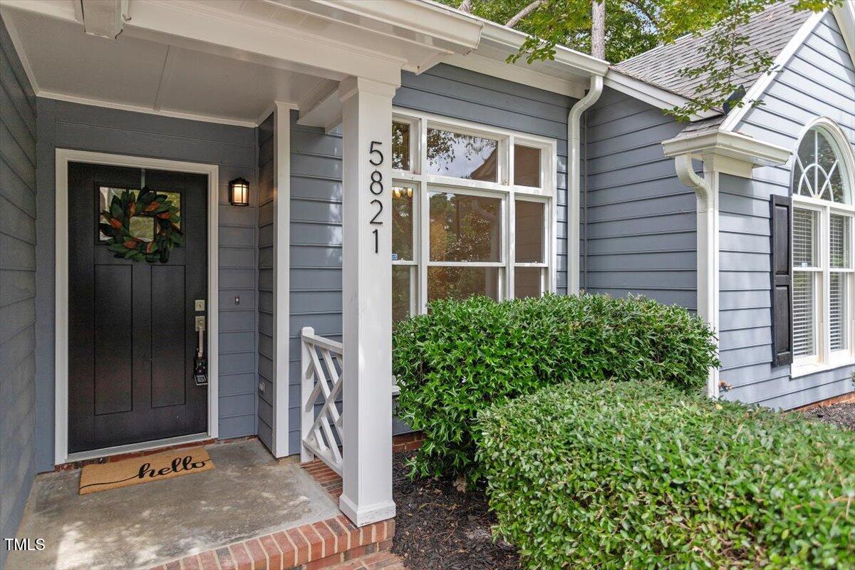 5821 Edgebury Road Raleigh, NC 27613 - Photo 2 of 37 a front view of a house with a yard