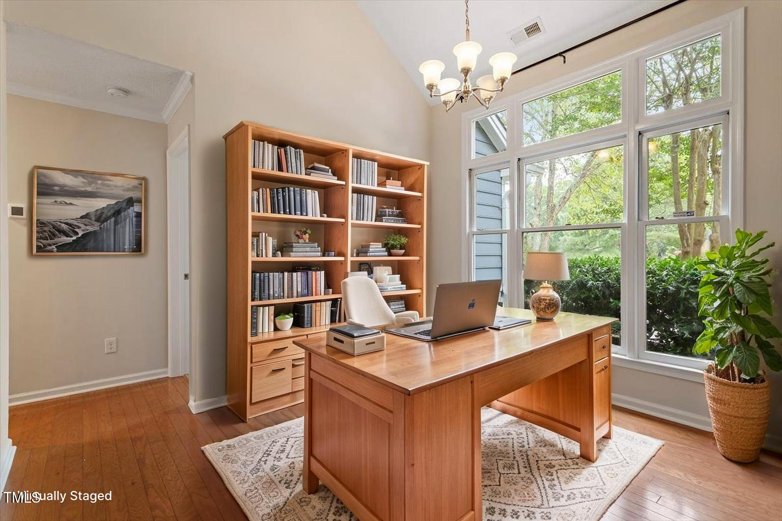 5821 Edgebury Road Raleigh, NC 27613 - Photo 5 of 37 a work room with furniture and a potted plant