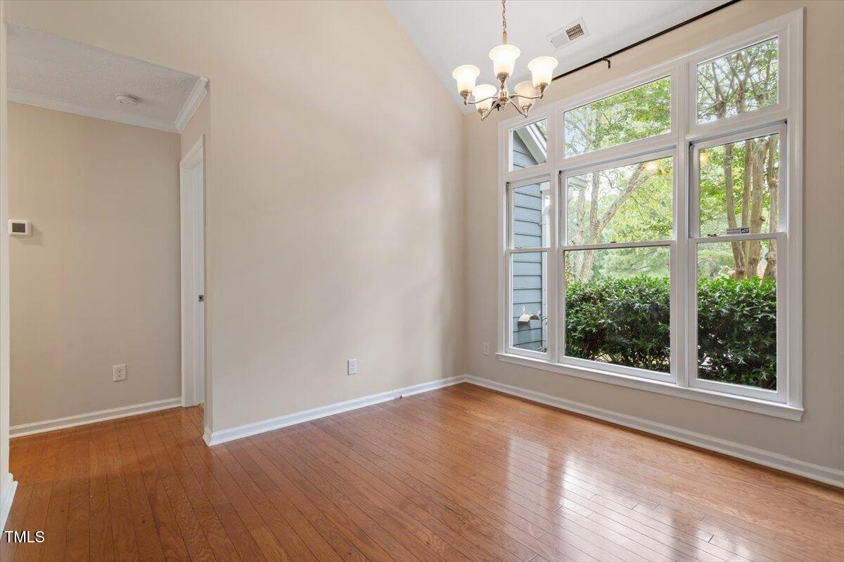 5821 Edgebury Road Raleigh, NC 27613 - Photo 7 of 37 a view of an empty room with a window