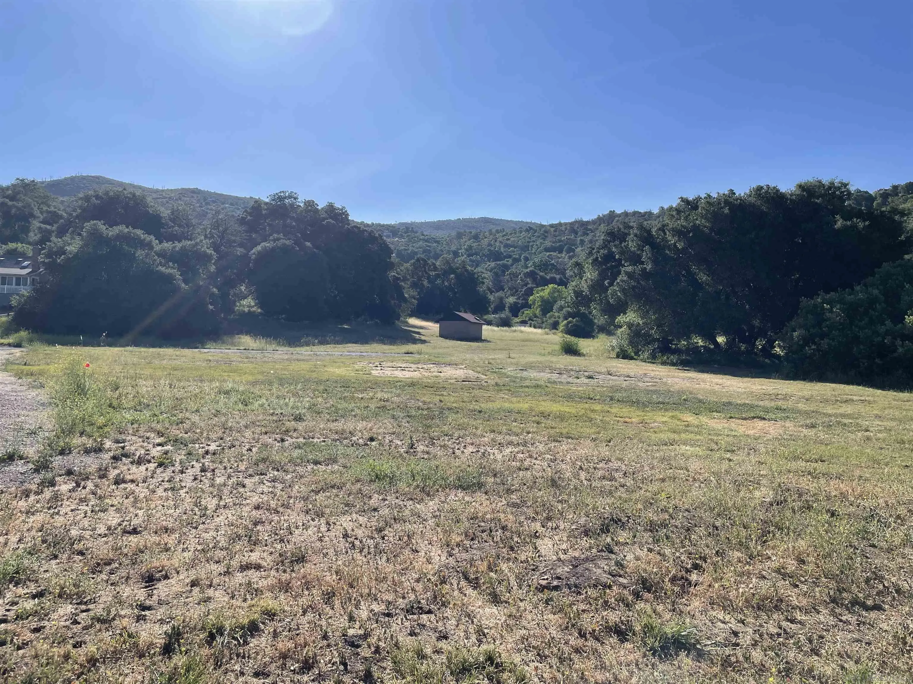5750 Forest Meadow Road, Unit 1 Julian, CA 92036 - Photo 22 of 36 a view of a field with mountains in background