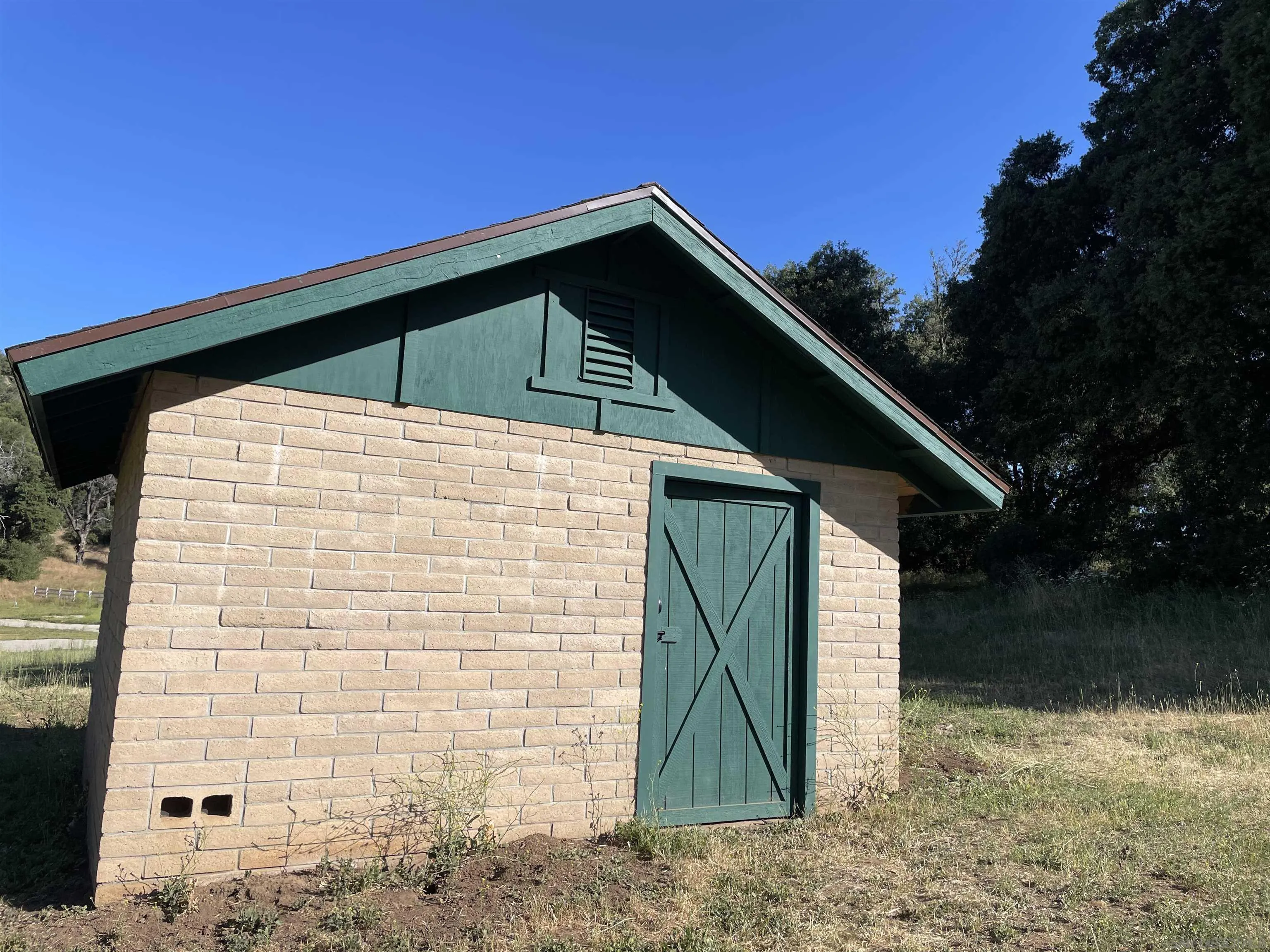 5750 Forest Meadow Road, Unit 1 Julian, CA 92036 - Photo 27 of 36 a front view of a house with garden