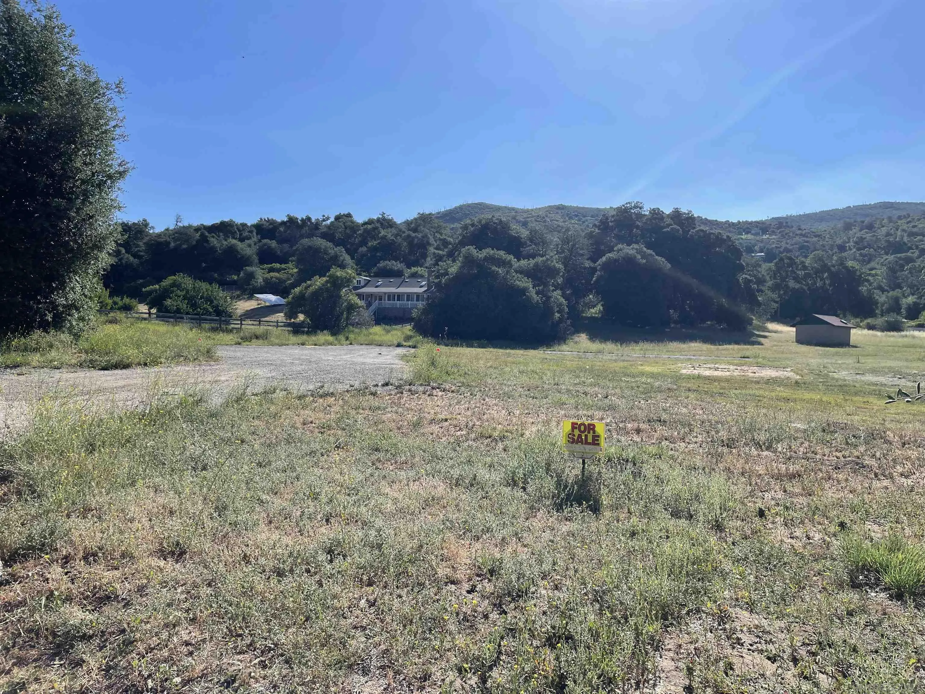 5750 Forest Meadow Road, Unit 1 Julian, CA 92036 - Photo 36 of 36 a view of a field with mountains in the background