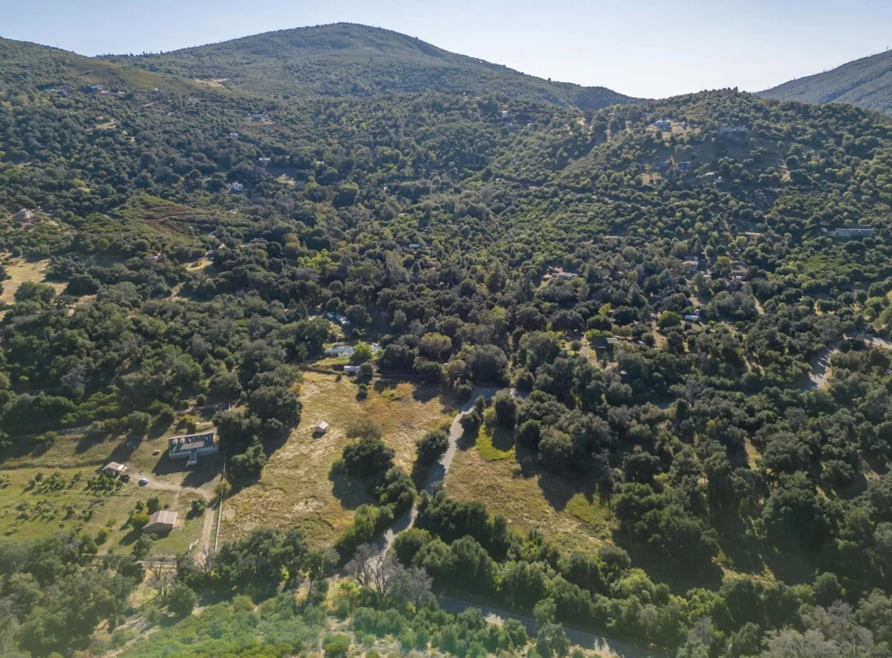 5750 Forest Meadow Road, Unit 1 Julian, CA 92036 - Photo 6 of 36 a view of a mountain in the distance in a field