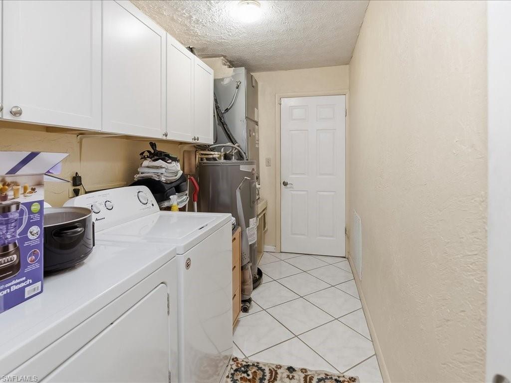 3890 27th Avenue Southwest Naples, FL 34117 - Photo 19 of 38 a view of storage and utility room with washer and dryer