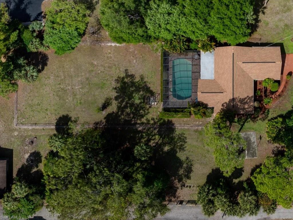 3890 27th Avenue Southwest Naples, FL 34117 - Photo 27 of 38 an aerial view of a house with a yard and garden