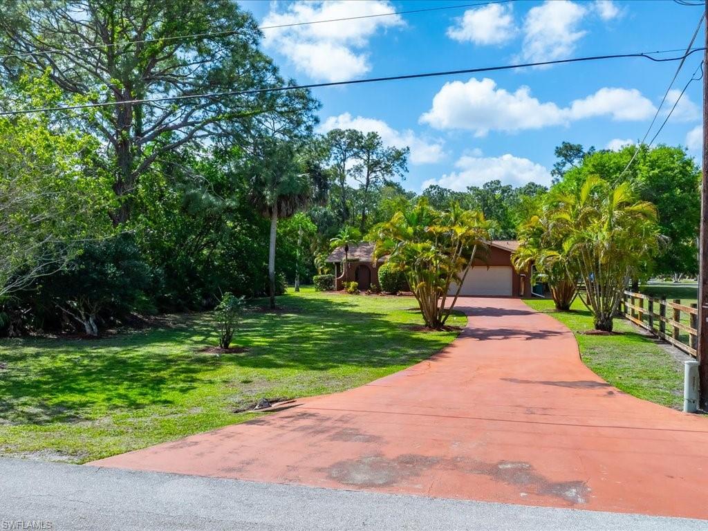 3890 27th Avenue Southwest Naples, FL 34117 - Photo 3 of 38 a view of a park with plants and trees