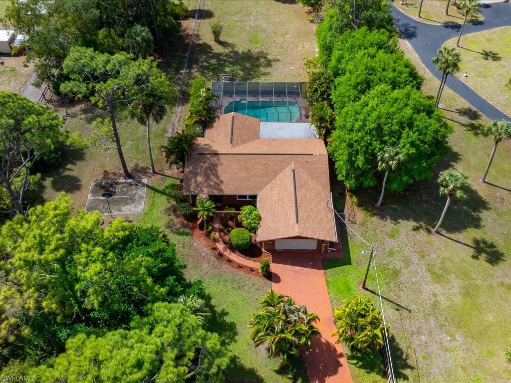 3890 27th Avenue Southwest Naples, FL 34117 - Photo 31 of 38 an aerial view of a house with a yard