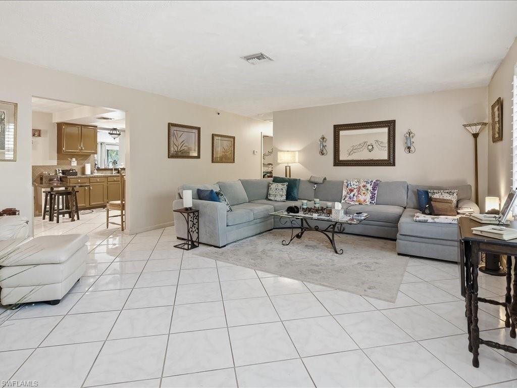 3890 27th Avenue Southwest Naples, FL 34117 - Photo 6 of 38 a living room with furniture and a couch