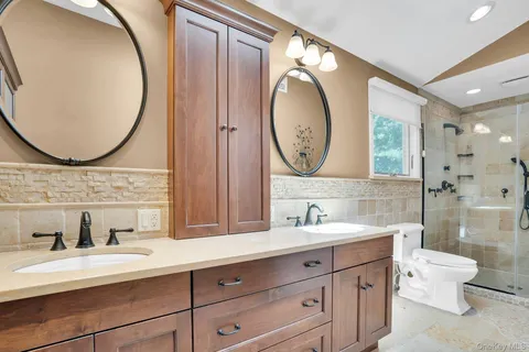 a bathroom with a sink a vanity and a mirror