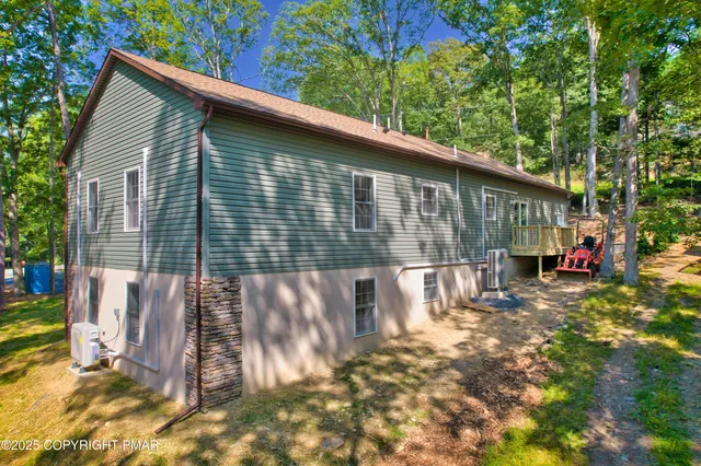 a living room with stainless steel appliances kitchen island granite countertop furniture and a kitchen view