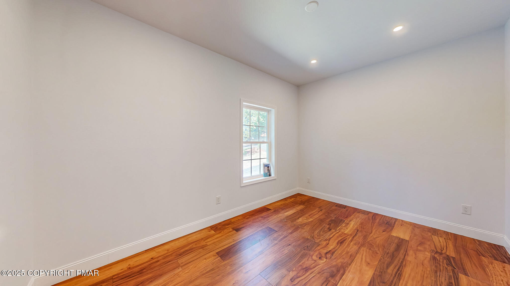 269 Stafford Drive Bushkill, PA 18324 - Photo 25 of 42 an empty room with wooden floor and window