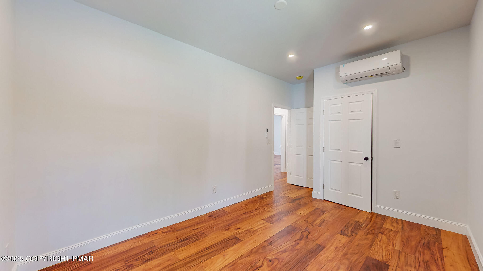 269 Stafford Drive Bushkill, PA 18324 - Photo 26 of 42 a view of a room with wooden floor and white walls
