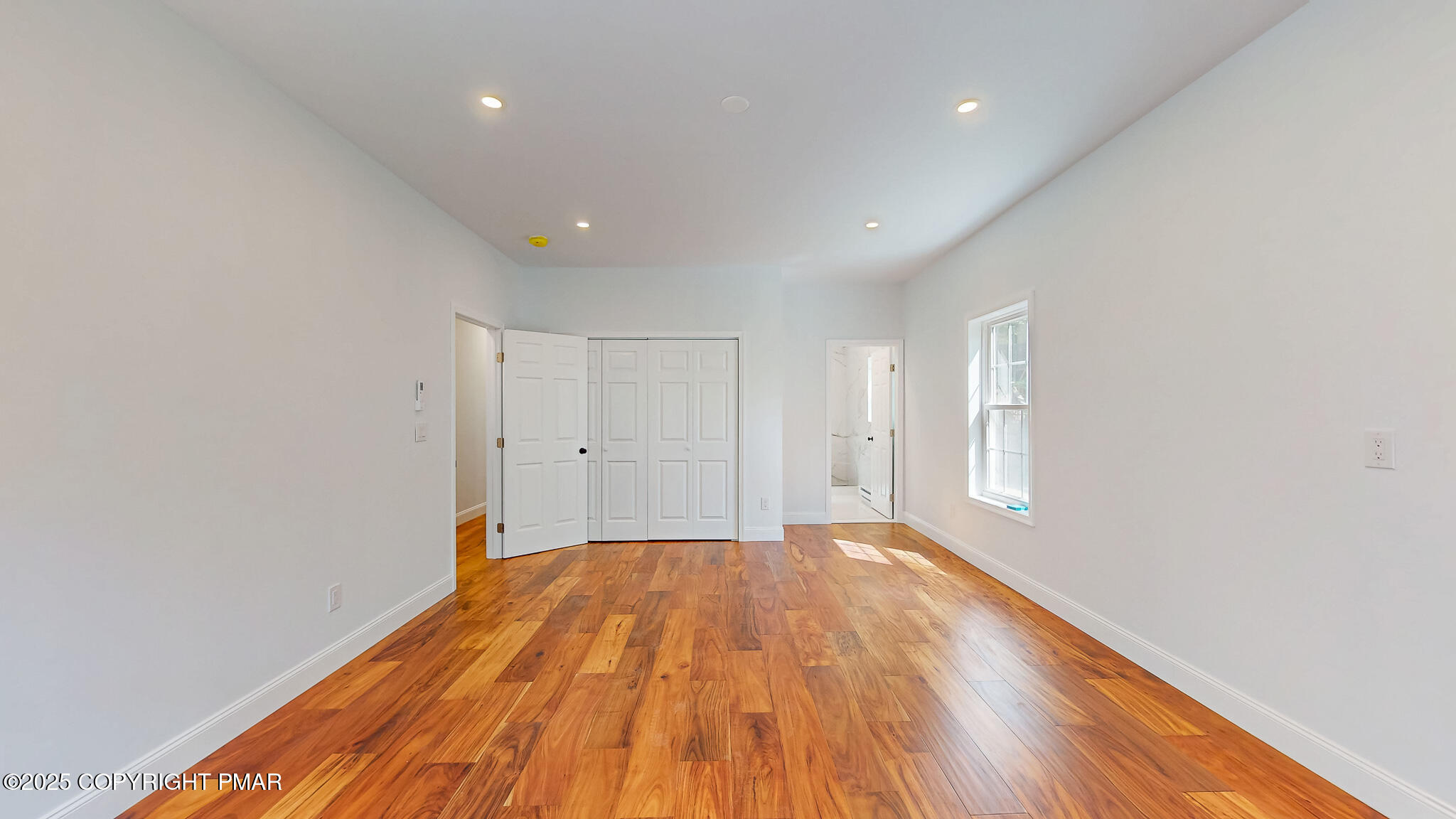 269 Stafford Drive Bushkill, PA 18324 - Photo 30 of 42 a view of a room with wooden floor and white walls