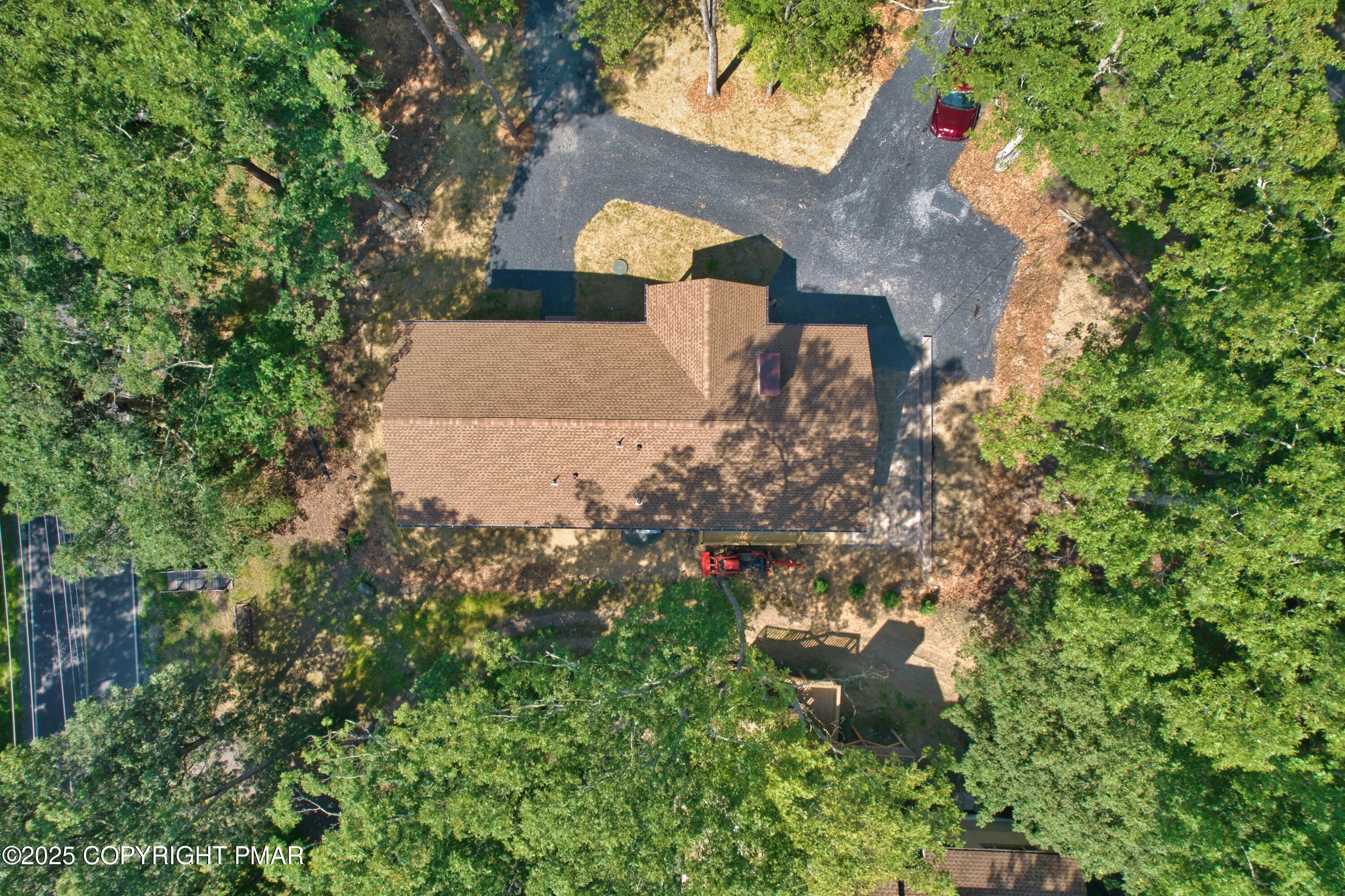269 Stafford Drive Bushkill, PA 18324 - Photo 41 of 42 an aerial view of a house with a yard and large trees