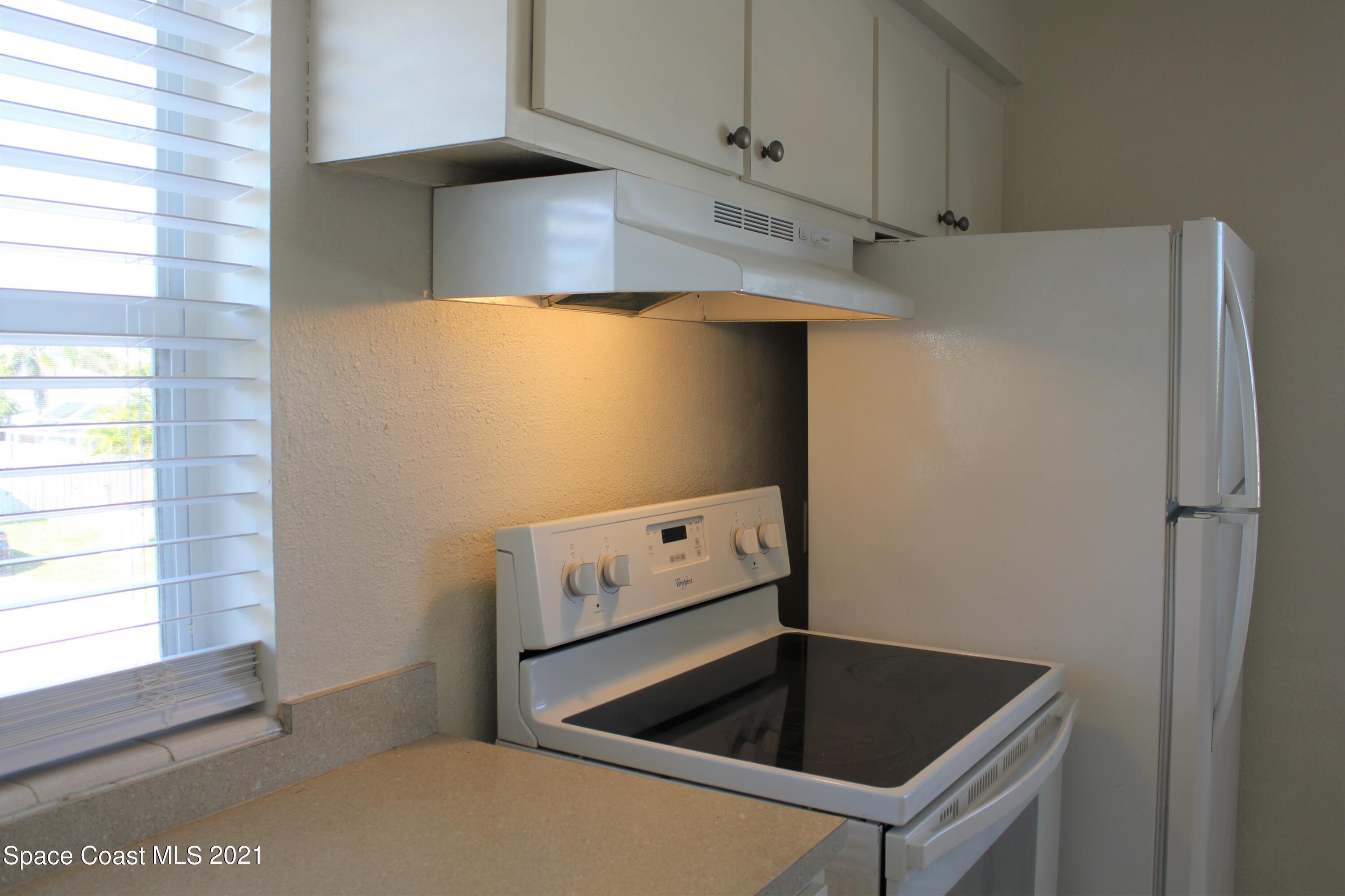 651 Palm Drive, Unit E3 Satellite Beach, FL 32937 - Photo 13 of 25 a room with storage and utility
