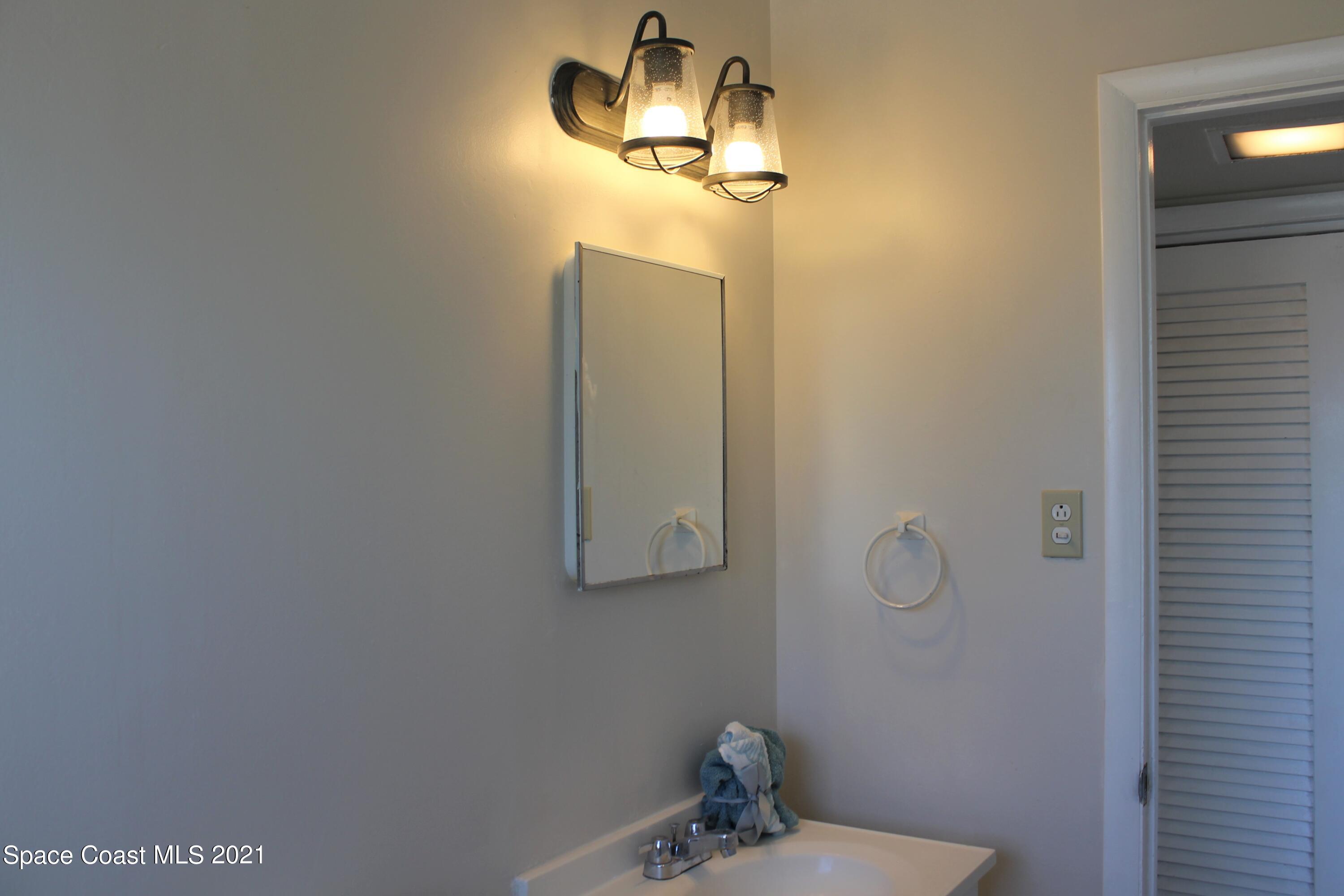 651 Palm Drive, Unit E3 Satellite Beach, FL 32937 - Photo 16 of 25 a bathroom with a shower