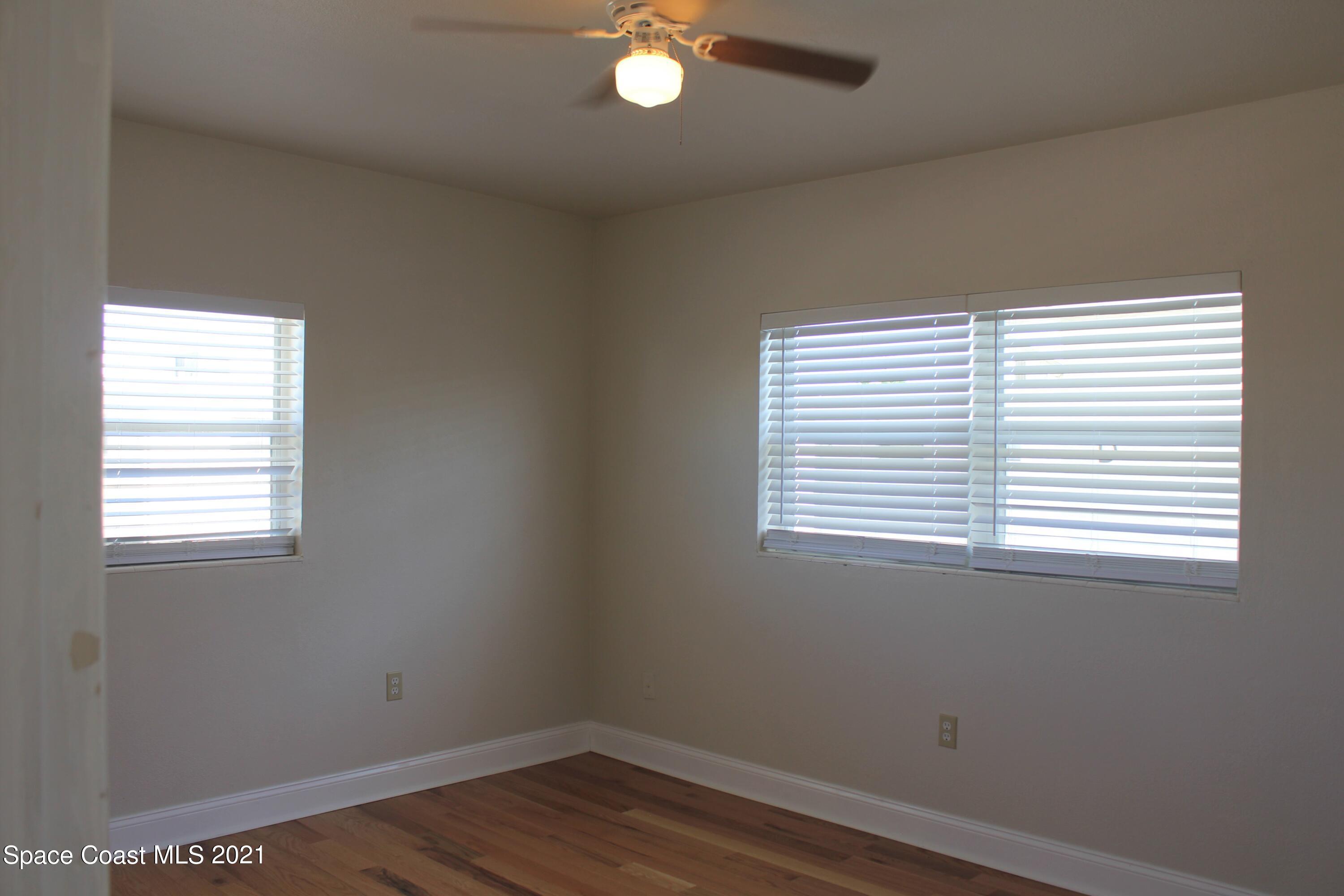 651 Palm Drive, Unit E3 Satellite Beach, FL 32937 - Photo 19 of 25 an empty room with a window