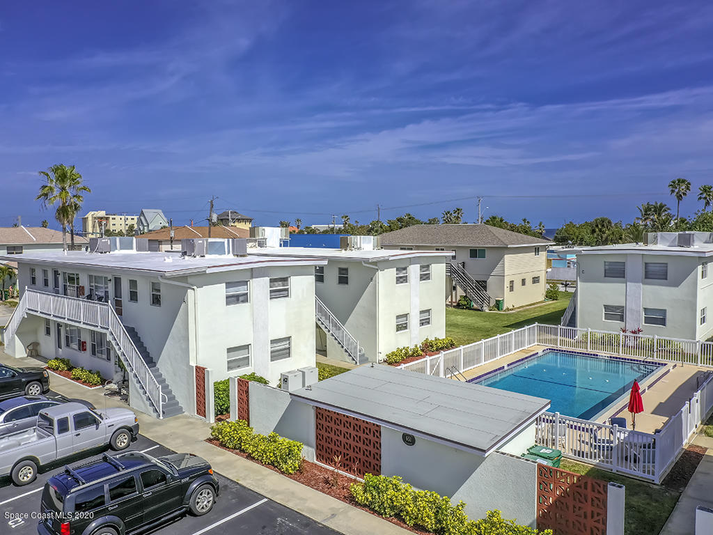651 Palm Drive, Unit E3 Satellite Beach, FL 32937 - Photo 2 of 25 a view of a patio with table and chairs