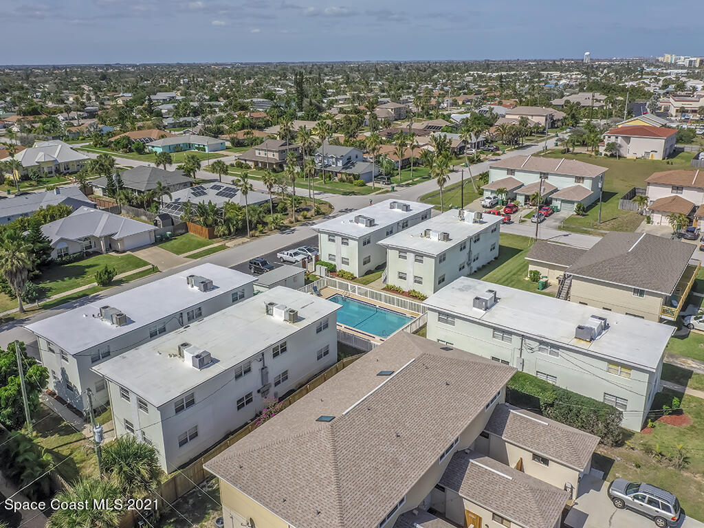 651 Palm Drive, Unit E3 Satellite Beach, FL 32937 - Photo 22 of 25 an aerial view of a house with a garden