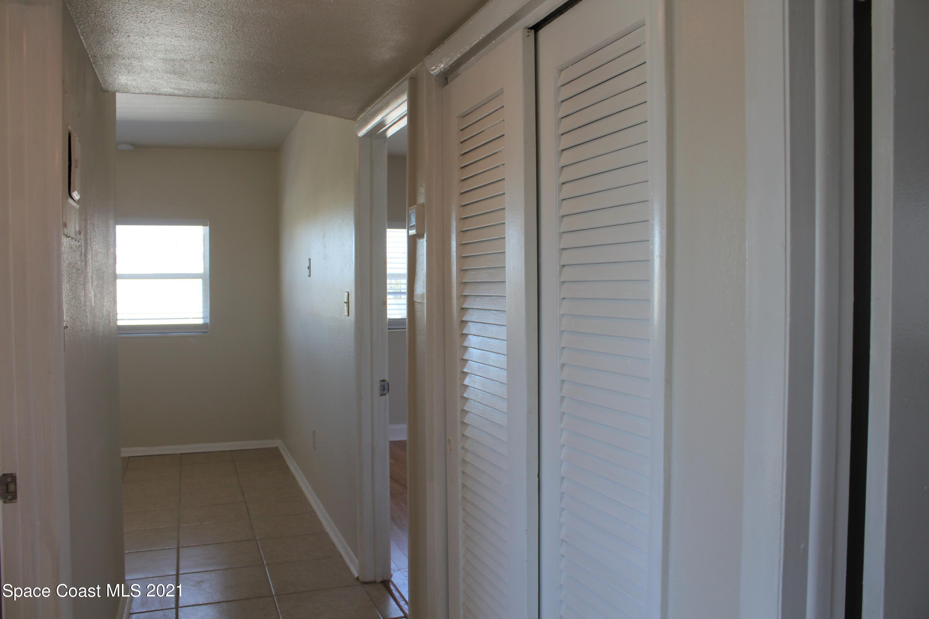 651 Palm Drive, Unit E3 Satellite Beach, FL 32937 - Photo 7 of 25 a bathroom with a shower and a sink