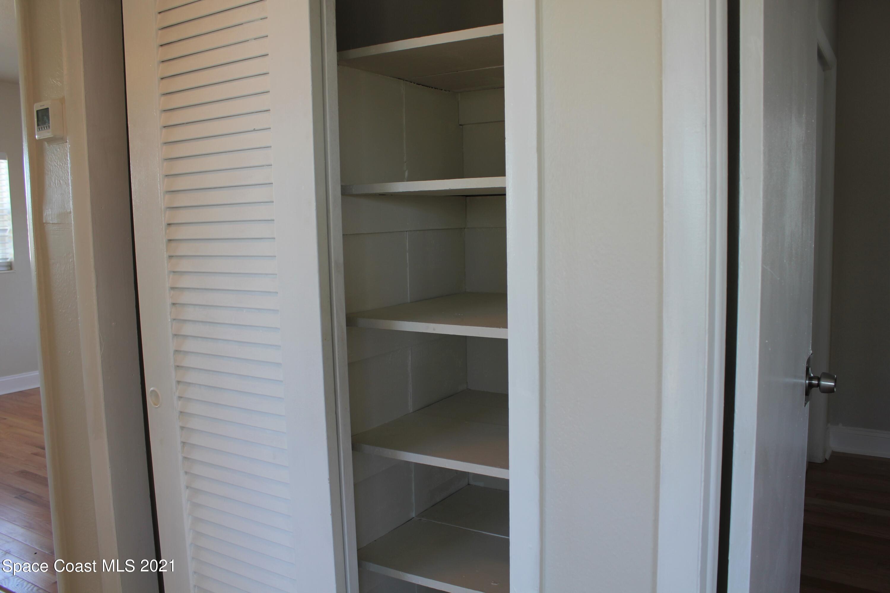 651 Palm Drive, Unit E3 Satellite Beach, FL 32937 - Photo 8 of 25 a view of an empty walk in closet