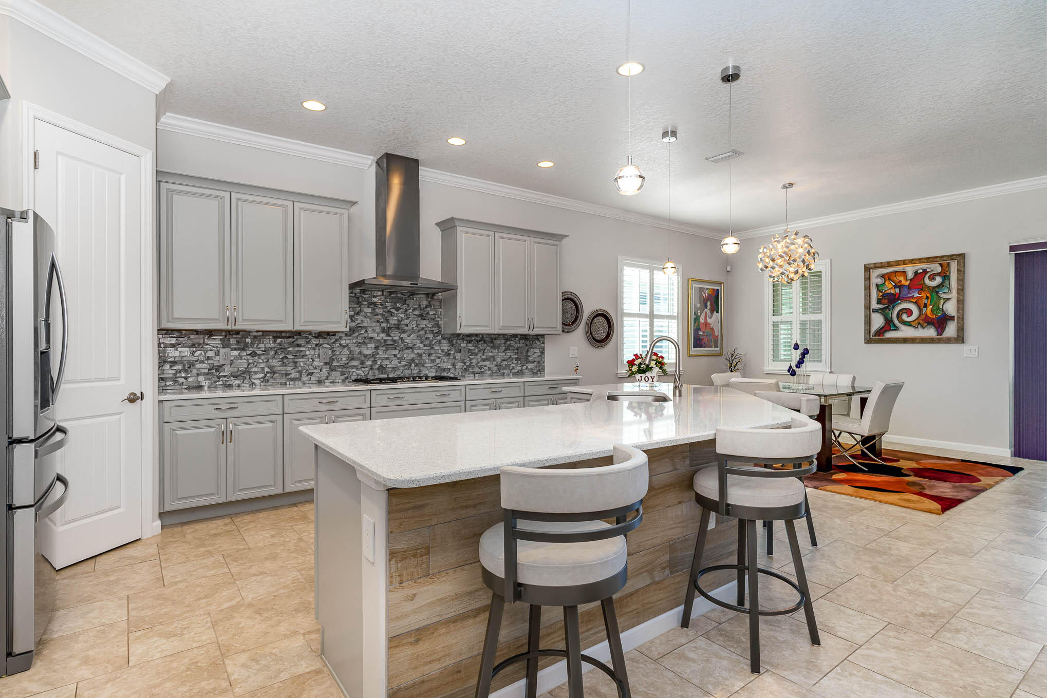 3750 Alamanda Key Drive Melbourne, FL 32901 - Photo 12 of 86 a kitchen with stainless steel appliances kitchen island granite countertop a sink and cabinets