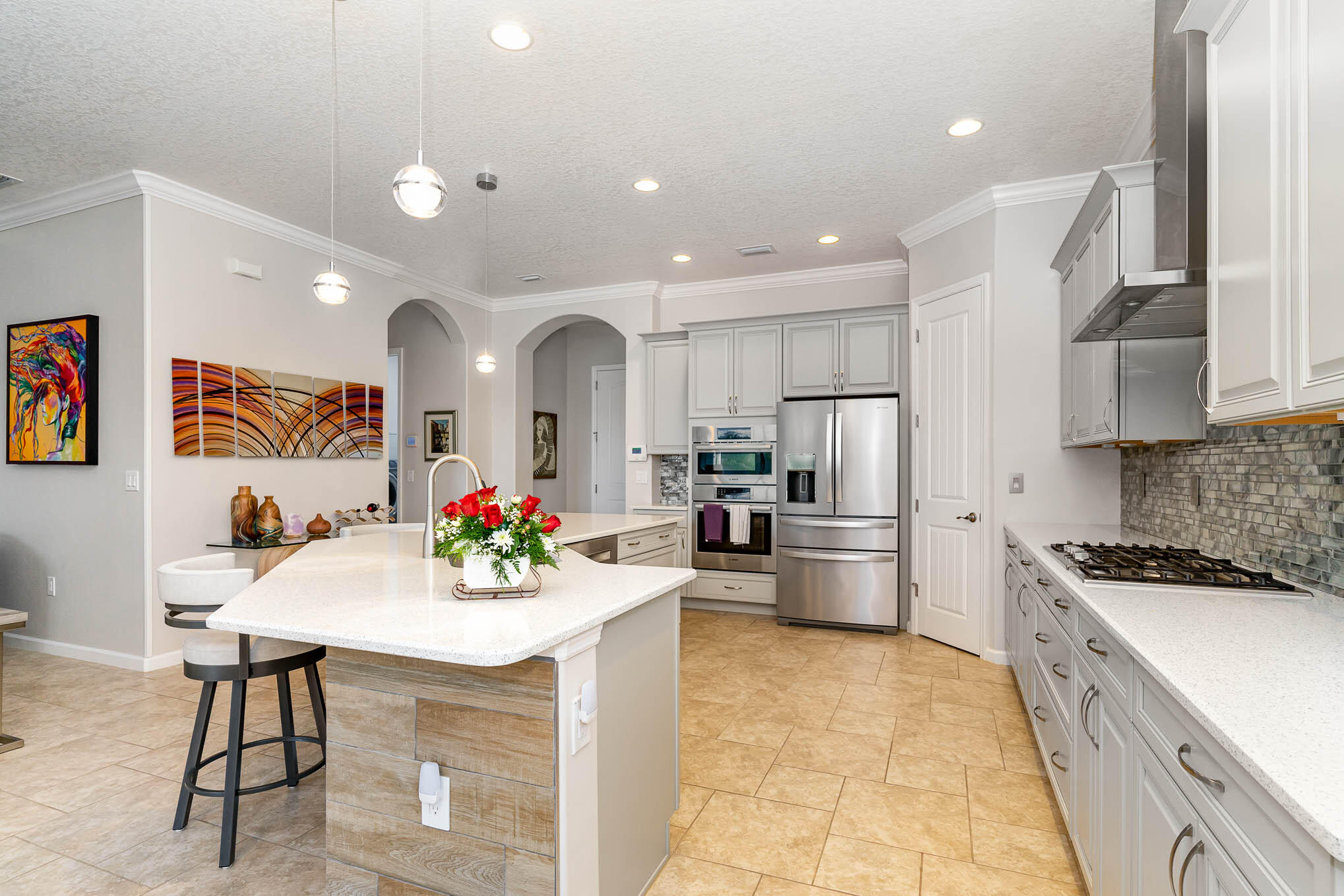 3750 Alamanda Key Drive Melbourne, FL 32901 - Photo 14 of 86 a kitchen with stainless steel appliances kitchen island granite countertop a sink and cabinets