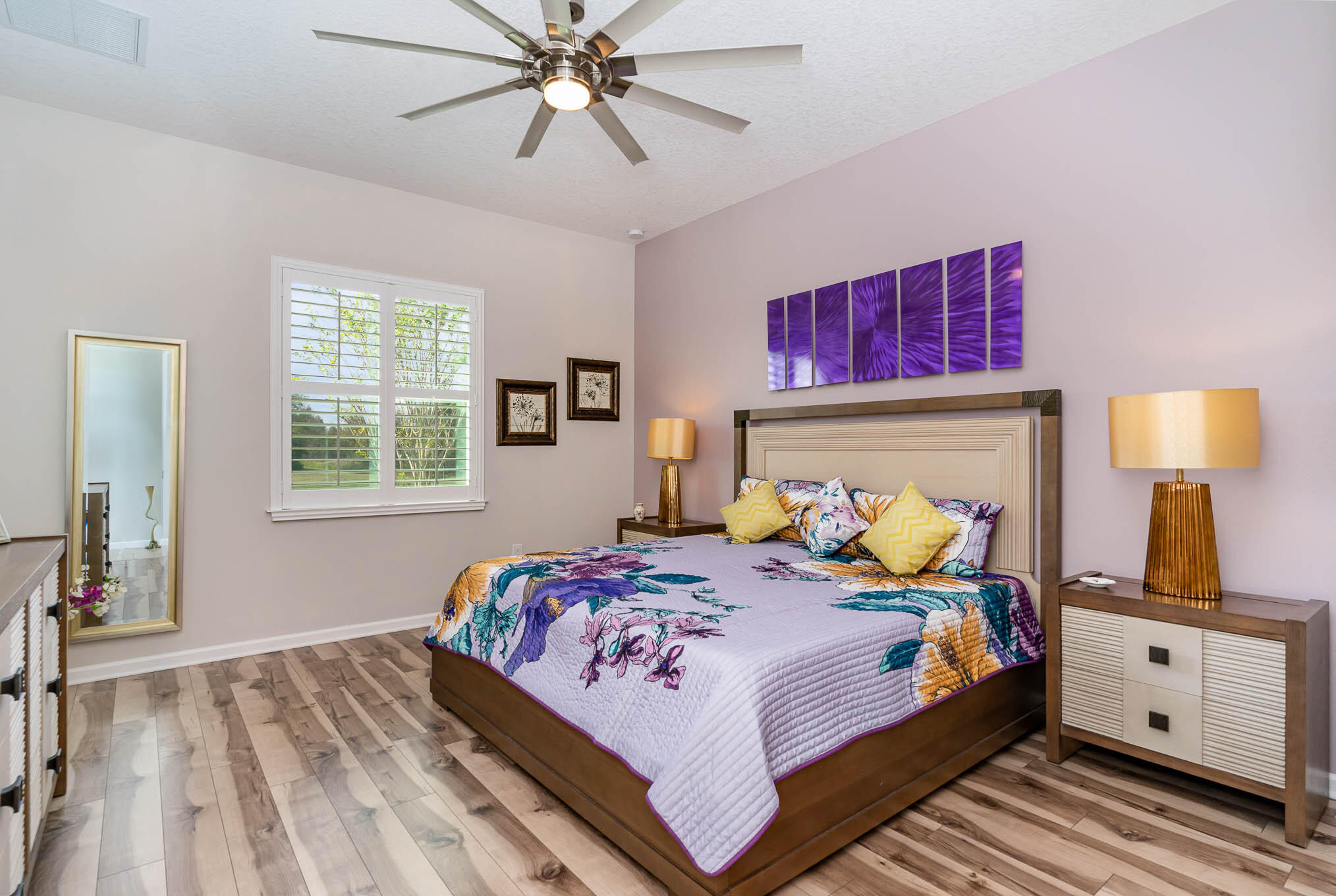 3750 Alamanda Key Drive Melbourne, FL 32901 - Photo 21 of 86 a bedroom with a bed and wooden floor