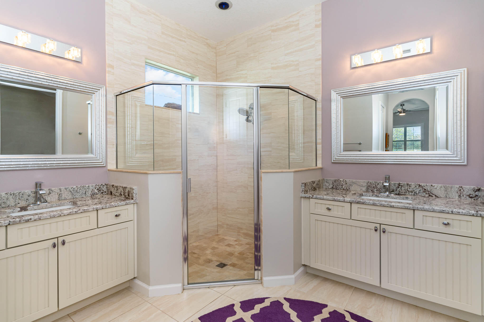 3750 Alamanda Key Drive Melbourne, FL 32901 - Photo 23 of 86 a bathroom with a shower sink vanity and mirror