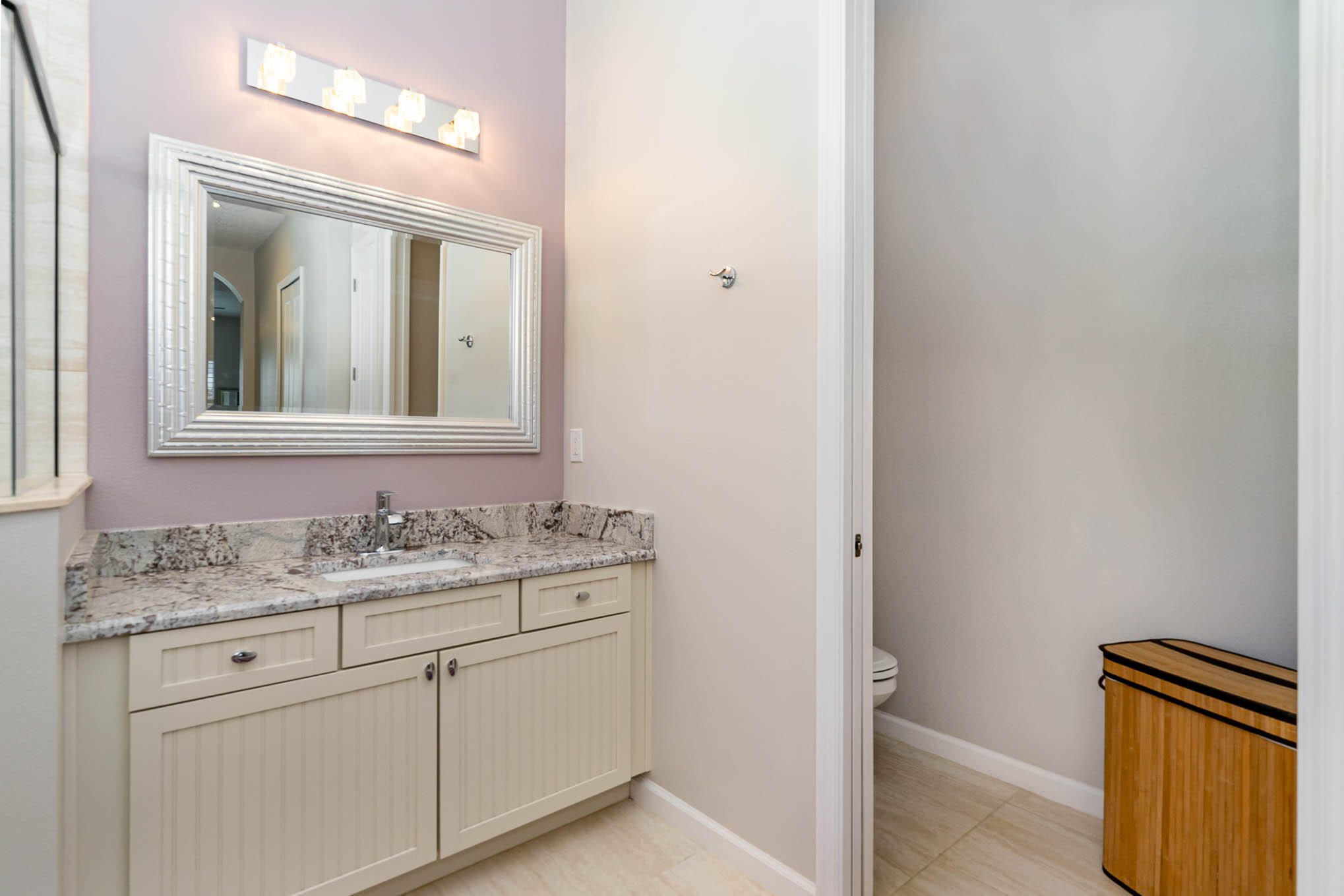 3750 Alamanda Key Drive Melbourne, FL 32901 - Photo 24 of 86 a bathroom with a granite countertop sink and a mirror