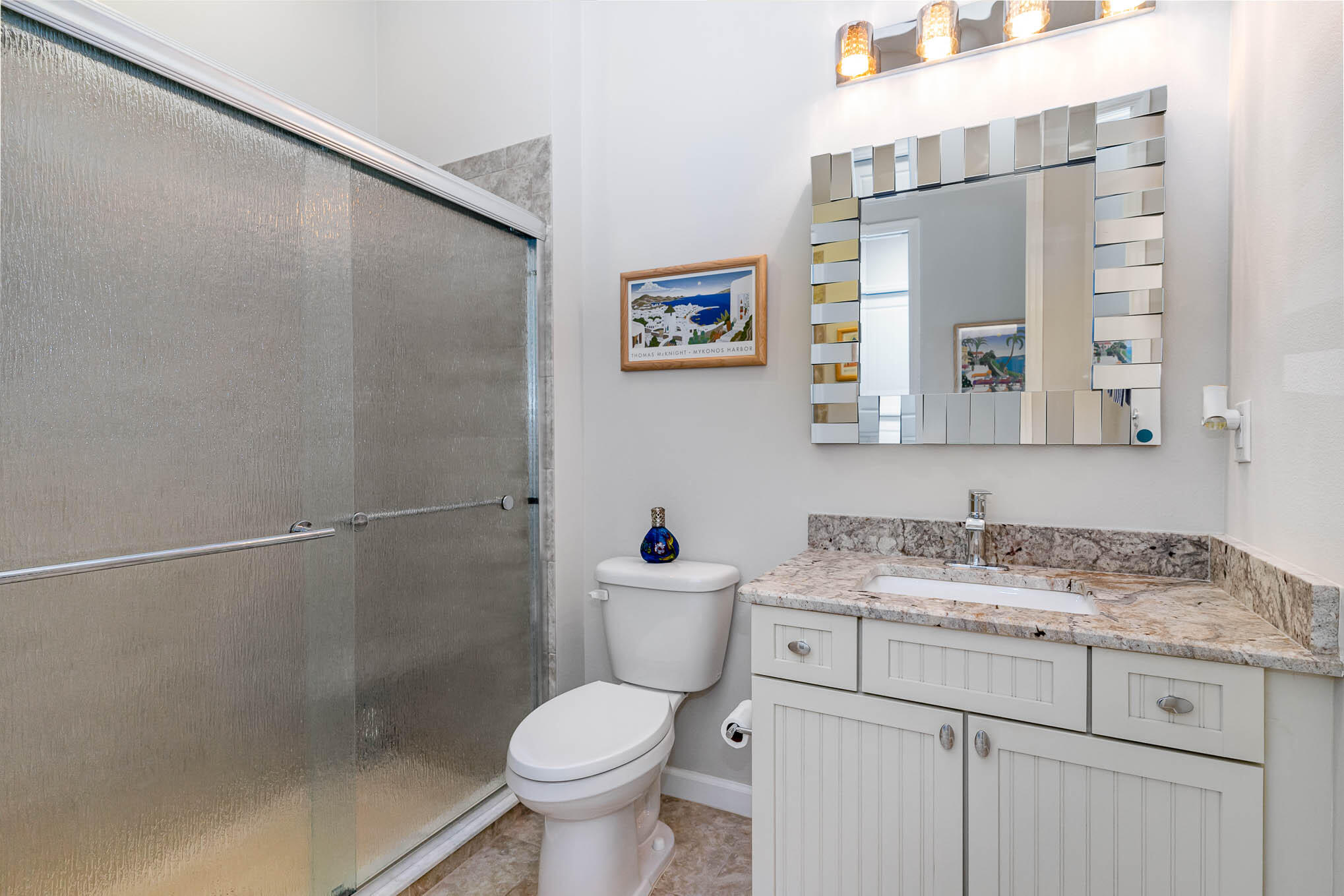 3750 Alamanda Key Drive Melbourne, FL 32901 - Photo 26 of 86 a bathroom with a granite countertop sink toilet and a mirror