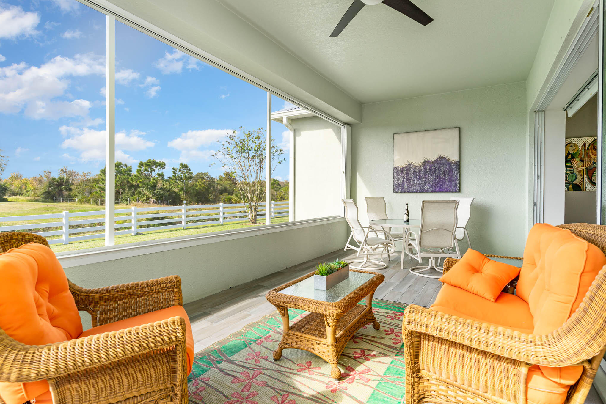 3750 Alamanda Key Drive Melbourne, FL 32901 - Photo 32 of 86 a living room with furniture and a floor to ceiling window