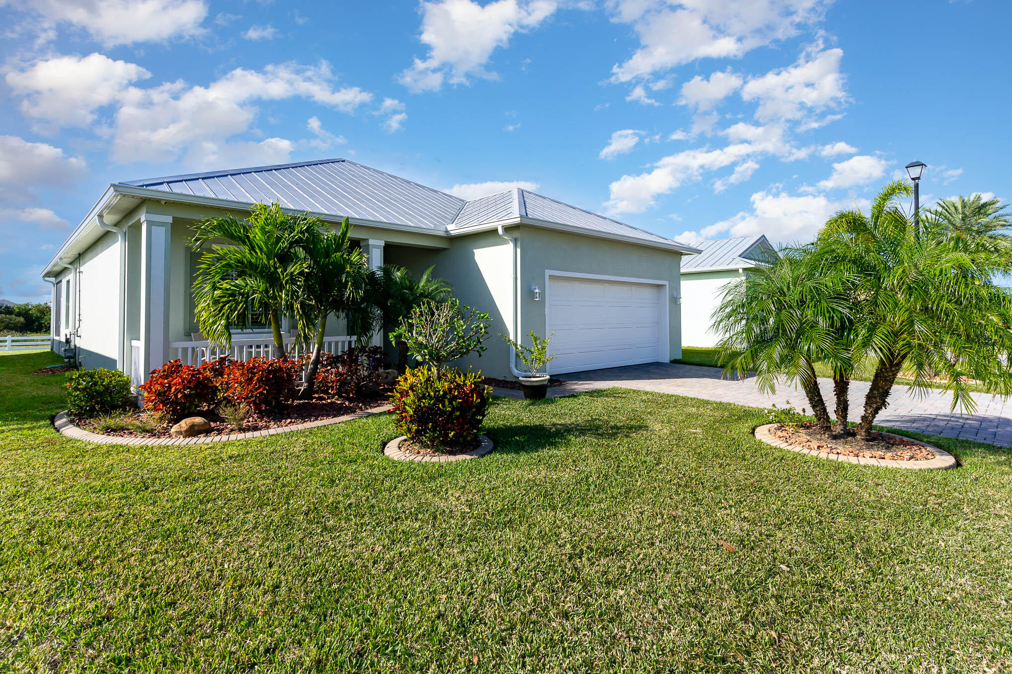 3750 Alamanda Key Drive Melbourne, FL 32901 - Photo 4 of 86 a view of a house with backyard sitting area and garden
