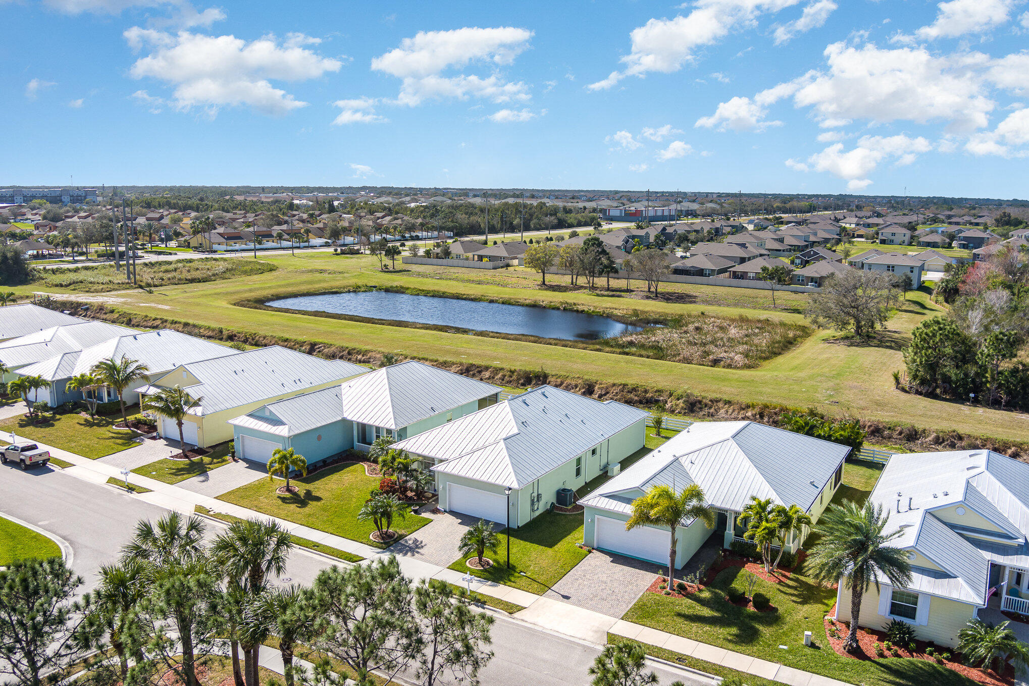 3750 Alamanda Key Drive Melbourne, FL 32901 - Photo 50 of 86 an aerial view of residential houses with outdoor space and lake view