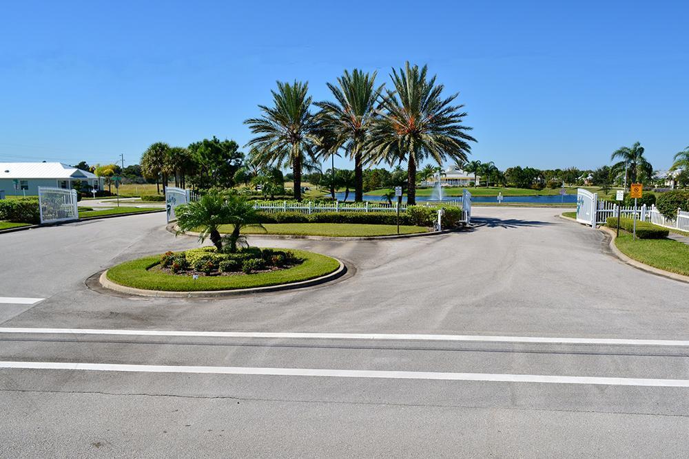 3750 Alamanda Key Drive Melbourne, FL 32901 - Photo 58 of 86 a view of a swimming pool with a table and chairs
