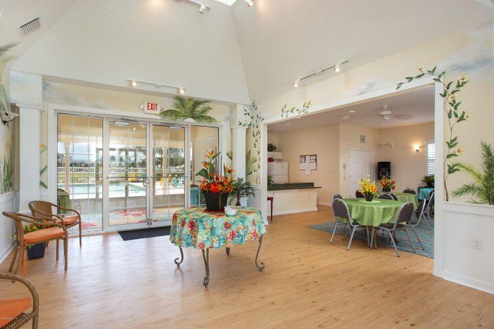 3750 Alamanda Key Drive Melbourne, FL 32901 - Photo 61 of 86 a living room filled with furniture and a large window