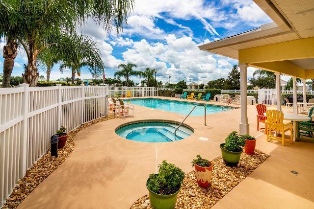 3750 Alamanda Key Drive Melbourne, FL 32901 - Photo 70 of 86 a view of a swimming pool with a patio