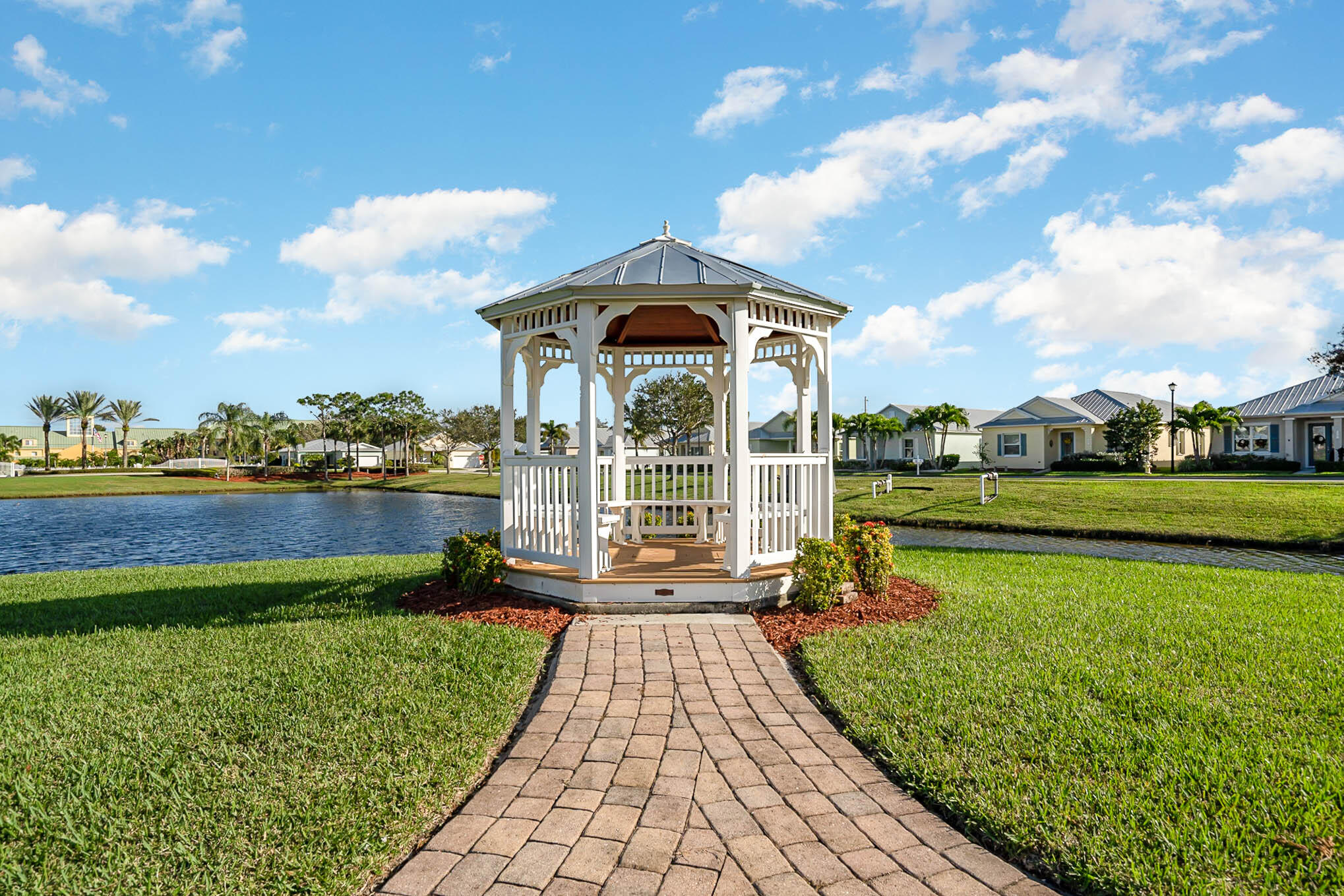 3750 Alamanda Key Drive Melbourne, FL 32901 - Photo 71 of 86 a view of a lake with a garden