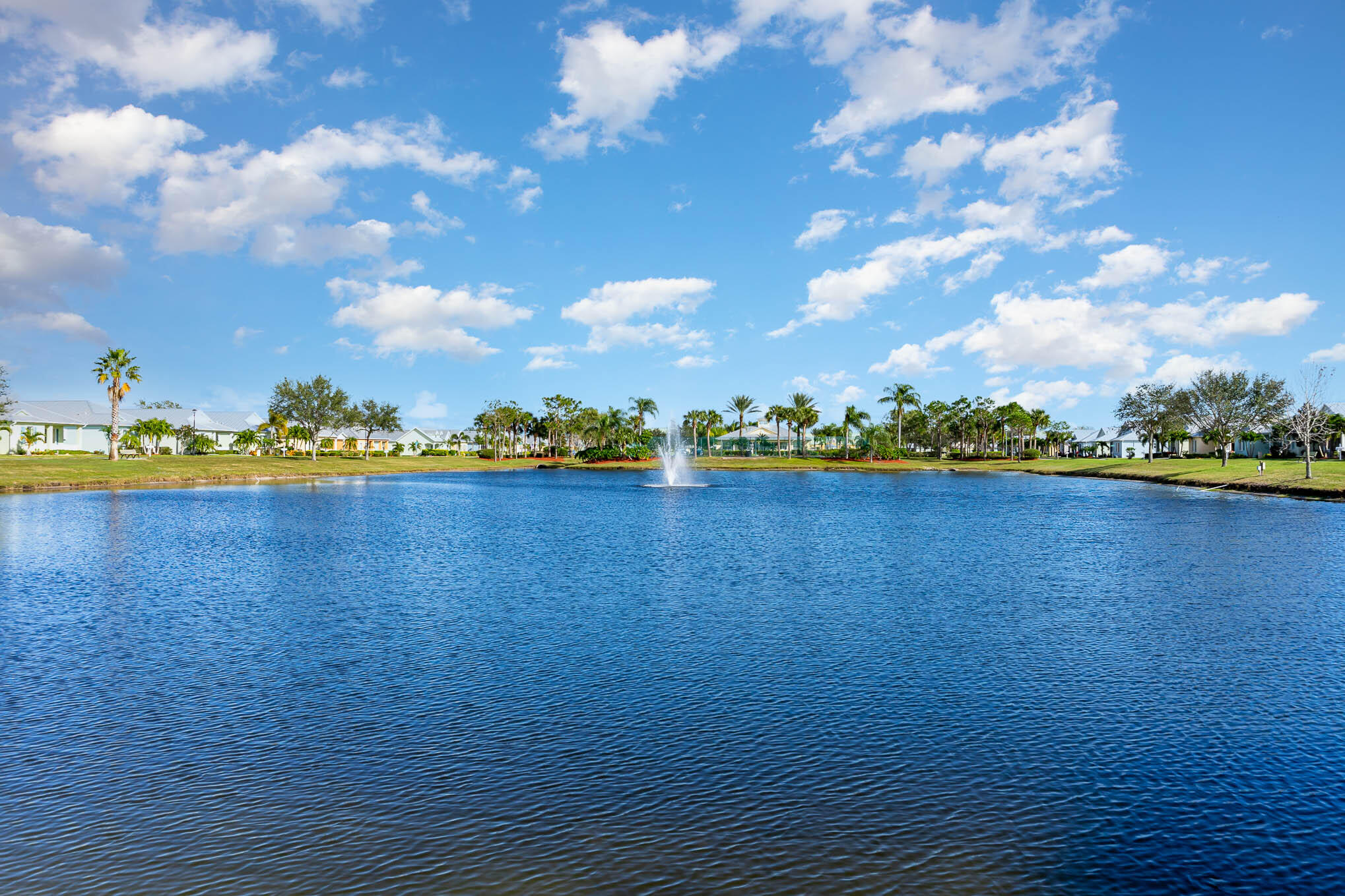 3750 Alamanda Key Drive Melbourne, FL 32901 - Photo 8 of 86 a view of a lake with houses in the back