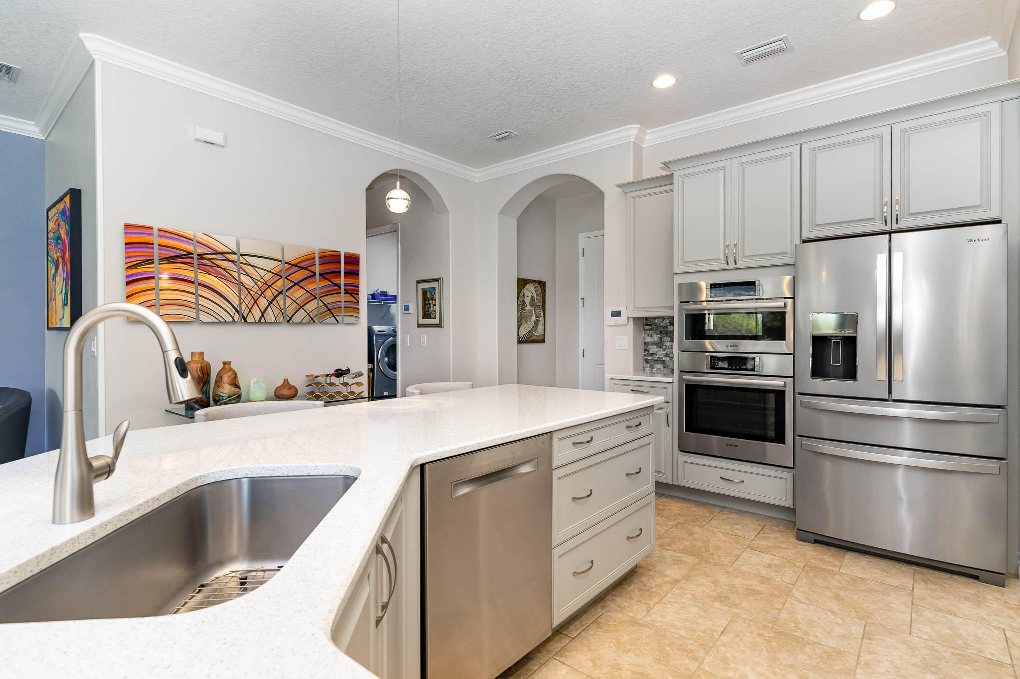 3750 Alamanda Key Drive Melbourne, FL 32901 - Photo 9 of 86 a kitchen with granite countertop a sink stainless steel appliances and cabinets
