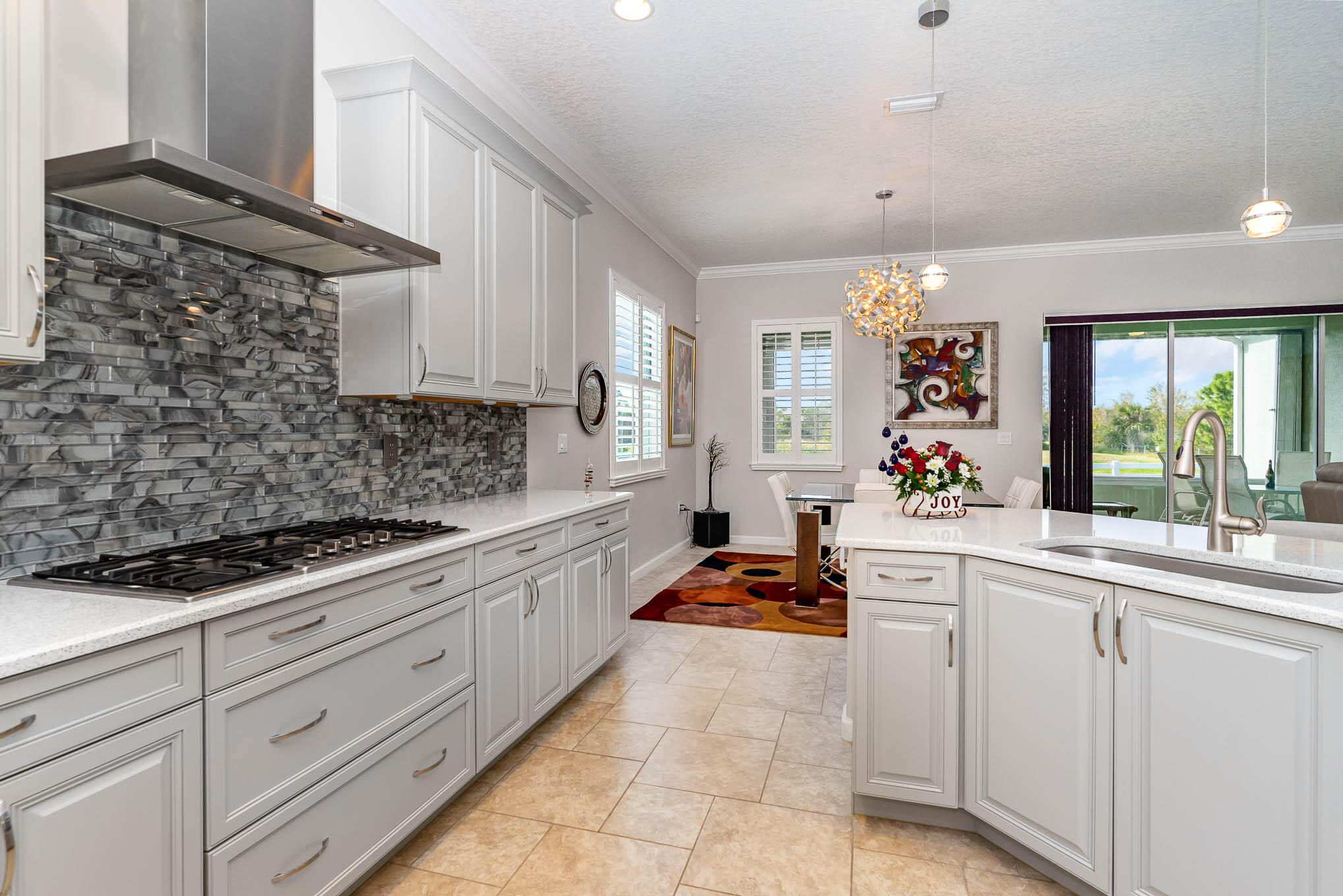 3750 Alamanda Key Drive Melbourne, FL 32901 - Photo 10 of 86 a kitchen with granite countertop a sink stainless steel appliances and cabinets