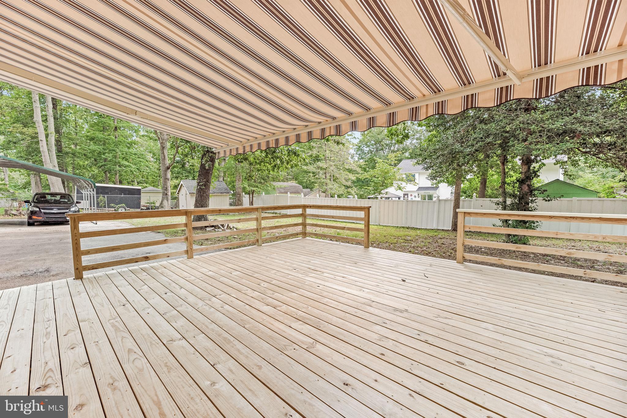 11432 Rawhide Road Lusby, MD 20657 - Photo 11 of 32 Large Deck w/ Awning