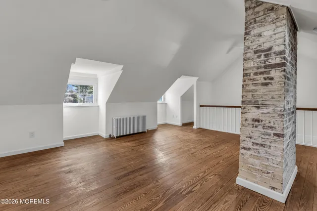 wooden floor in an empty room with windows