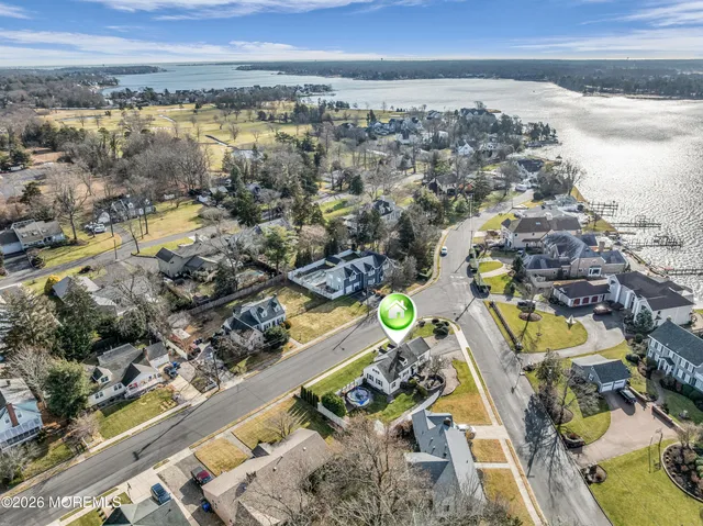 an aerial view of a residential houses with outdoor space